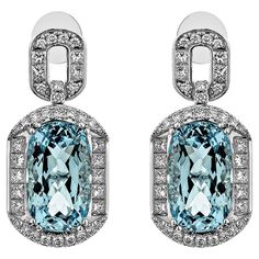 Presented an antique Aquamarine Drop Earring that is accented with White Diamond all around and enhances the beauty of the Earring. This Earring accented with Diamonds is made in White Gold, which looks very Elegant. Aquamarine Drop Earring in 18Karat White Gold with White Diamond. Aquamarine: 16.369 carat, 16.3X9.8mm size, Cushion shape. White Diamond: 1.705 carat, 2.10mm size, Princess shape, G color, VS clarity. White Diamond: 0.084 carat, 1.80mm size, round shape, G color, VS clarity. White Luxury Wedding White Topaz Diamond Earrings, Luxury Oval Diamond Earrings For Evening, Luxury Platinum Diamond Earrings Hallmarked, Luxury Oval Diamond Earrings For Formal Occasions, Luxury Oval Diamond Earrings For Formal Events, Luxury Oval Diamond Earrings, Luxury Diamond Earrings With Halo Design For Evening, Luxury Pave Set Earrings For Formal Occasions, Luxury Pave Setting Earrings For Formal Events