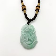 This is a high grade jadeite jade pendant necklace. It is exquisitely hand carved, so each pendant is different in some way. The pendant is completely natural jade, un-dyed and in its natural form. The pendant is carved in the form of the Chinese Zodiac - Snake. The years of the Snake include 1917, 1929, 1941, 1953, 1965, 1977, 1989, 2001, 2013, 2025, 2037... The necklace is adjustable - one size fits all. It comes with a gift box. The item is hand carved and natural so it may have imperfections Carved Jade Pendant Jewelry, Carved Jade Pendant Necklace, Carved Jade Jewelry For Good Luck, Snake Chinese Zodiac, Carved Pendant, Year Of The Snake, Natural Form, Jade Necklace, Jade Bracelet