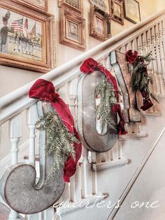 christmas decorations are hanging on the banister