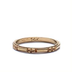 an 18k yellow gold band with flowers