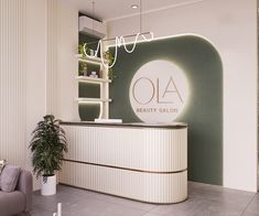 the front desk of a beauty salon with a potted plant on it's side