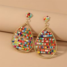 Complete a vibrant look with the vivid color of these 18k gold-plated drop earrings embellished with howlite. 1.85" W x 3.23" L 18k gold-plated copper / multicolor howlite Creative Jewelry, Vivid Color, Accessories Jewelry Earrings, Beaded Pendant, Hook Earrings, Pendant Earrings, Resin Jewelry, Boho Earrings, Women's Earrings