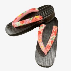 Women/Girls Japanese wooden geta sandals in pink and red floral print. It is made with a lightweight kiri wood with rubber soles and Chirimen creped polyester V shape toe-thong secularly knotted at the bottom. These modern-style geta sandals are traditionally worn with summer cotton kimono called yukata or jinbei. The Cloth v-shaped toe thong called 'hanao' comes in different fabric designs, a perfect accessory for your outfit. You can also wear them with a maxi skirt or dress for a modern look. Geta Sandals, Red Floral Print, Cotton Kimono, Fabric Designs, Pink And Red, Summer Cotton, Different Fabrics, Red Floral, V Shape