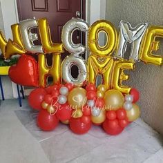 some balloons that say welcome home