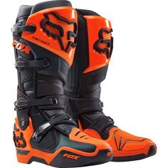 a pair of orange and black boots on a white background