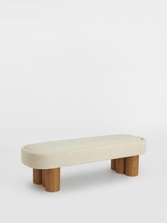 a white bench sitting on top of a wooden table