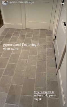 a tile floor with the words, i'm not grouted and i'm loving it even more