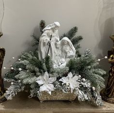 an arrangement of christmas decorations on a mantle