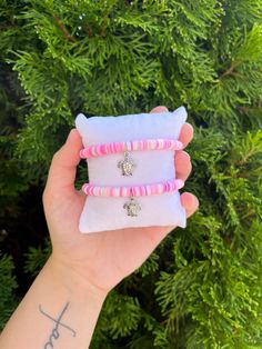 These cute bracelets are made from clay beads and a cute sea turtle charm. Each one has an elastic string to fit most size wrists Adjustable Beaded Bracelets With Charms For Beach, Cute Clay Bead Bracelet Ideas, Pink Sea Turtle, Cute Sea Turtle, Bracelet Stuff, Beach Inspiration, Pink Sea, Turtle Charm, Bead Ideas