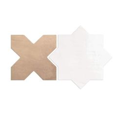 two white and brown tiles on top of each other, one with an x in the middle