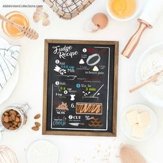 a chalkboard with some food on it next to bowls and utensils,