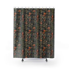 a shower curtain with an orange flower pattern on the front and back side, hanging from a metal rod