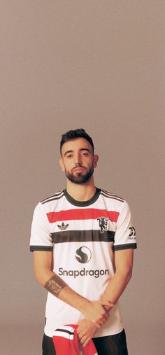 a man standing in front of a gray background