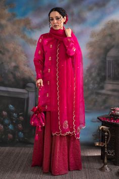 Hot pink kurta featuring embroidered sequin detail on a floral pattern base. Comes with palazzo, scalloped hem dupatta and inner.
Components: 4
Pattern: Embroidered
Type Of Work: Sequin,Zari
Neckline: Round
Sleeve Type: Full
Fabric: Pattu Silk, Katan Silk, Chanderi Silk
Color: Pink
Other Details: 
Straight silhouette
Closure: Palazzo: Elasticated waistband
Note: Potli held by model is not for sale
Occasion: Mehendi and Haldi,Sangeet - Aza Fashions Kurta Palazzo Set, Pink Kurta, Palazzo Set, Katan Silk, Fashion App, Scalloped Hem, Embroidered Silk, Set For Women, Aza Fashion