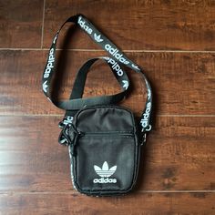 New With Out Tag Adidas Crossbody Bag . Black Color . Zipper Closure Crossbody Shoulder Bag With Mobile Phone Bag For Streetwear, Black Mobile Phone Shoulder Bag For Streetwear, Black Crossbody Shoulder Bag For Streetwear, Black Shoulder Bag With Zipper For Streetwear, Black Bags With Zipper Closure For Streetwear, Black Streetwear Bag With Zipper Closure, Streetwear Crossbody Shoulder Bag With Zipper Closure, Streetwear Crossbody Chest Bag With Zipper Closure, Streetwear Crossbody Chest Bag With Zipper