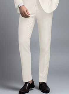 Indulge in the exquisite craftsmanship of these outstanding Loro Piana Bianchi Wool Silk Linen Pants, designed for a man of discerning taste. Meticulously woven from premium wool, silk, and linen, it offers a luxuriously smooth texture with a subtle sheen, ensuring both comfort and elegance. This impeccably tailored pant, featuring a solid pattern and a beige hue, provides versatility and a refined look suitable for various occasions. It effortlessly transitions from professional settings to formal events with seamless elegance.    A marriage of elegance and comfort, Loro Piana fabrics are made using the highest quality raw materials in the world, in their purest form or blended together. A sophisticated response to the dictates of contemporary elegance, these fabrics lend themselves to a Classic Wedding Trousers, Classic Silk Straight Dress Pants, Luxury Silk Trousers, Fitted Silk Cream Bottoms, Elegant Silk Wedding Pants, Elegant Slim Fit Wedding Bottoms, Elegant Slim Fit Bottoms For Wedding, Elegant Beige Pants For Wedding, Elegant Straight Leg Wedding Bottoms