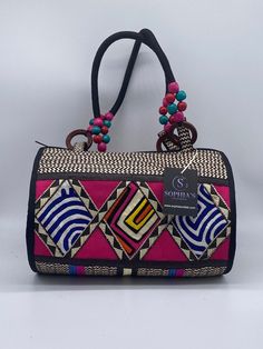 These beautiful handbags are made from Cana Flecha which is an indigenous palm fiber found in the northern territory of Colombia. They are beautifully hand crafted by the people from the Zenu tribes in Colombia. These handbags are colorful with vibrant colors, which is a pure reflection on the region and the warmness of these master artisans that work in this industry every day. Multicolor Rectangular Jute Bags, Traditional Satchel Beach Bag, Traditional Satchel Bag For Beach, Multicolor Rectangular Jute Shoulder Bag, Artisan Handwoven Handheld Shoulder Bag, Handwoven Artisan Handheld Shoulder Bag, Artisan Handwoven Rectangular Bag, Traditional Shoulder Bag With Braided Handles, Traditional Woven Satchel For Everyday Use