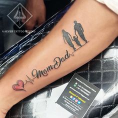 a person with a tattoo on their leg that says, mom dad and son together