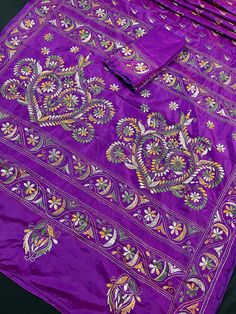 Gorgeous Dual Tone Purple Color saree with handwoven Kantha stitch work in Multi- color. Item: SareeColor : Dual Tone Purple Color Base Fabric: Bangalori Silk Blouse piece : YesBlouse material: Bangalori Silk Work: Handloom, Kantha Work Fall & Edging (Yes/No) : Yes Disclaimer -:- Color variation is possible due to various reasons like phone or desktop setting, resolution etc. Please don't hold us responsible. Our aim is to put the exact color of the Saree.- Colors are very Subjective. Hence a co Bohemian Purple Sets With Zari Work, Unstitched Traditional Handloom Choli, Transitional Purple Embroidered Dupatta, Transitional Embroidered Purple Dupatta, Traditional Handloom Long Sleeve Sets, Eid Resham Embroidery Paithani Silk Sets, Traditional Long Sleeve Handloom Sets, Embroidered Paithani Silk Sets With Traditional Drape, Semi-stitched Embroidered Paithani Silk Sets