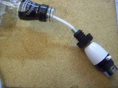 a white and black cord connected to a water bottle