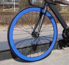 a close up of a blue bicycle tire