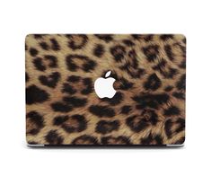 an animal print macbook case with the apple logo on it