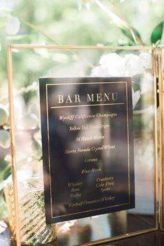 a table with a menu and flowers on it