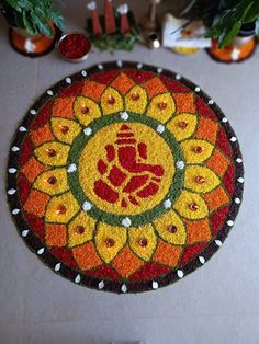 a colorful mat with an image of a hand in the center and flowers on it