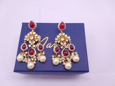 Silver Moissanite Polki Chandbali, Wedding Jewelery, Moissanite Polki Earring, Ruby Polki Earring, Ruby Earring, Wedding Jewellery, Chandbali *𝐀𝐛𝐨𝐮𝐭 𝐏𝐫𝐨𝐝𝐮𝐜𝐭* Product Code :-  TE 1014 Product Type :- Dangle Earring Product Weight :- 24.56 Gram Gemstone Used :- Moissanite, Labmade Ruby, Labmade Pearl Material :- 925 Starling Silver, Labmade Gemstones Size :- 6.5x2 Cm Intricate, hand-crafted, Pure Silver Polki Earrings, studded with high-quality Moissanite Polki comes with Push back, made in 92.5 silver with 22ct gold plating. The product comes with 92.5 silver stamping -Product can be made in gold as well. -If any product is not ready, It takes 2-3 weeks to make in pure silver -We also look forward to Bulk Orders. We shall consider special discount on Bulk Orders. Navrii (TM) by Wedding Temple Jewelry Earrings With Elegant Design, Wedding Earrings With Stone Work, Hand-set Chandbali Pearl Earrings For Wedding, Heavy Pearl Drop Earrings For Wedding, Temple Jewelry Style Chandelier Earrings For Wedding, Heavy Drop Pearl Earrings For Wedding, Traditional Pearl Drop Earrings For Wedding, Festive Bridal Earrings With Stone Work For Anniversary, Traditional Pearl Drop Bridal Earrings For Wedding