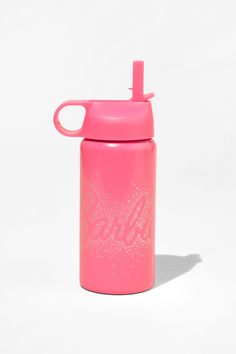 a pink water bottle sitting on top of a white surface