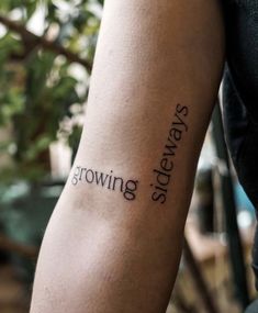 a person with a tattoo on their arm that reads growing sidewayss and the words grow sidewayss are written in cursive font