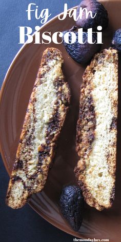 Two vanilla biscotti marbled with fig jam closeup on a brown plate with figs. Fig Jam Dessert, Fig Jam Cookies, Fig Jam Recipes, Fig Jam Cookies Recipe, Fig Jam Dessert Recipes, Recipes With Fig Jam, Holiday Biscotti, Homemade Biscotti