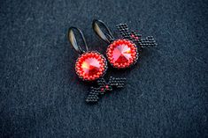 This earrings was made from black japanese MIYUKI and shimmer red glass crystals These earrings can be a great gift for your family and friends for the Halloween holiday. Also you can buy them for yourself on Halloween as an addition to your costume or separately as decorations for creating a festive mood. Available in a different color, just contact me All products are 100% hand made, made with love especially for you Please note that due to lighting effects, monitor's brightness, contrast and Handmade Red Crystal Earrings For Gift, Handmade Red Evening Earrings, Red Earrings As Halloween Gift, Red Earrings For Halloween Gift, Handmade Black Crystal Earrings For Party, Bright Jewelry, Black Japanese, Bat Earrings, Halloween Beads