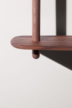 a close up of a wooden shelf on a wall