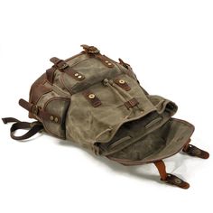 Discover a vintage-inspired waxed canvas backpack that blends classic and modern elements. Handcrafted for durability, this bag features: Robust Build: Made with waxed cotton canvas and crazy horse leather, offering a blend of style and practicality. Versatile Design: Ideal for hikes, work, or college, with a leather top handle, reinforced shoulder straps, and a drawstring opening with a protective flap. Ample Storage: Includes 4 exterior pockets (3 with clips, 1 with a zipper), and a spacious, Rugged Canvas Backpack For Outdoor, Vintage Large Capacity Bags For Outdoor Activities, Vintage Bags For Outdoor Activities With Large Capacity, Vintage Bags With Large Capacity For Outdoor Activities, Rugged Travel Backpack With Canvas Lining, Retro Canvas Backpack For Travel, Canvas Backpack With Pockets For Outdoor, Large Capacity Waxed Canvas Adventure Bag, Vintage Backpack With Large Capacity For Adventure