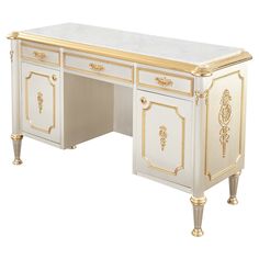 a white desk with gold trimmings on the top and bottom, in front of a white background