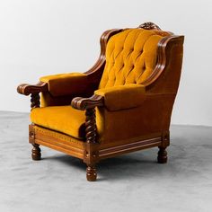 an old fashioned chair sitting on top of a cement floor