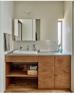 a bathroom with two sinks and mirrors in it