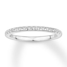 a white gold wedding band with princess cut diamonds