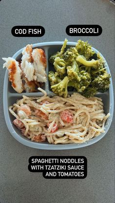 a lunch box with noodles, broccoli and shrimp