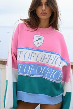 Don't call, don't text. Join our Out of Office posse in the official club crewneck. Fitted with retro stripes of pink, baby blue, and blue green, the OOO Club Sweatshirt features high quality, intricate embroidery and an oversized fit. OUT OF OFFICE embroidered design across chest DON'T CALL, DON'T TEXT ribbon design across chest Embroidered OOO shield emblem Thick ribbed trim along wrists, neckline, and waistband Soft, fuzzy interior This sweatshirt is made from 100% recycled fabric — 52% cotto Oversized Multicolor Letter Print Sweatshirt, Pink Cotton Sweatshirt For College, Spring Color Block Sweatshirt For Streetwear, Spring Streetwear Color Block Sweatshirt, Trendy Color Block Crew Neck Sweatshirt, Pink College Sweatshirt With Ribbed Cuffs, Pink Varsity Crew Neck Sweatshirt, Pink Varsity Sweatshirt For College, Pink Sweatshirt With Ribbed Cuffs For College