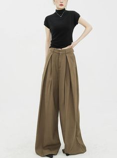 Infuse elegance into your wardrobe with our Wide Leg Criss-Cross Pleated Palazzo Trousers, a harmonious blend of comfort and chic.
Crafted with attention to detail, these trousers feature a high-waist cut for a flattering silhouette and come in a timeless black shade. Asymmetrical pleats add a touch of uniqueness, while the fluid fabric encapsulates a modern, commute-friendly vibe. They're perfect for both a professional setting and casual outings.
Pair them with a fitted blouse for work or a re Chic Tailored Brown Wide-leg Pants, Chic Tailored Brown Wide Leg Pants, Chic Brown Pants With Loosely Fitted Hips, Chic Brown Dress Pants For Spring, Chic Brown Spring Dress Pants, Elegant Brown Wide Leg Summer Pants, Chic Brown Wide Leg Dress Pants, Palazzo Shorts, Palazzo Trousers