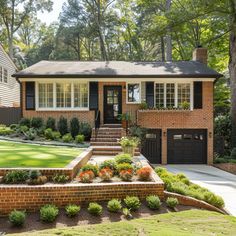 a brick house with landscaping and trees in the background