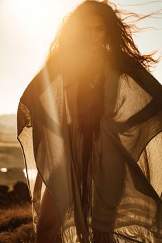 a woman with her hair blowing in the wind