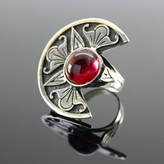 Sterling Silver Corundum Round Ring - Armenian Symbol Ring, Red Gemstone Ring, Autor's Design Ring, Statement Silver Ring, Armenian SilverThe ornament is copied from ancient Armenian national drawings.Author's handwork.Ring size - 4*3 cm.Ring weight - 13 g. Artisan Red Sterling Silver Rings, Bohemian Red Gemstone Rings, Artisan Red Ring For Gift, Handmade Artisan Red Rings, Handmade Red Garnet Ring, Artisan Red Ring Jewelry, Artisan Red Oval Jewelry, Traditional Red Ruby Ring In Sterling Silver, Handmade Antique Red Ruby Ring