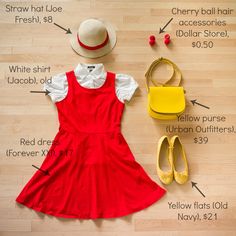 a red dress with white collar, yellow purse and straw hat on the floor next to other items