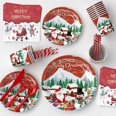 christmas themed plates and napkins on a table