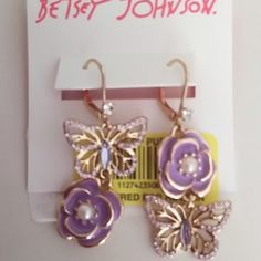 Mismatch Earrings With 5/8" Lavender Flower And Butterfly Suspended In Opposing Order By Rhinestone. Secure Fasteners. Gold Backing And Fixings. 2" Drop. Retail - $40. Nwt Purple Earrings For Spring Party, Spring Purple Flower Earrings For Pierced Ears, Elegant Purple Butterfly Earrings, Purple Earrings For Spring, Spring Party Purple Flower Earrings, Purple Flower Earrings For Spring Party, Mismatch Earrings, Flower And Butterfly, Betsey Johnson Earrings