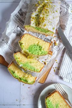 slices of cake sitting on top of newspaper next to a knife and fork