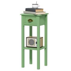 a green end table with a radio on it and books stacked on top of it